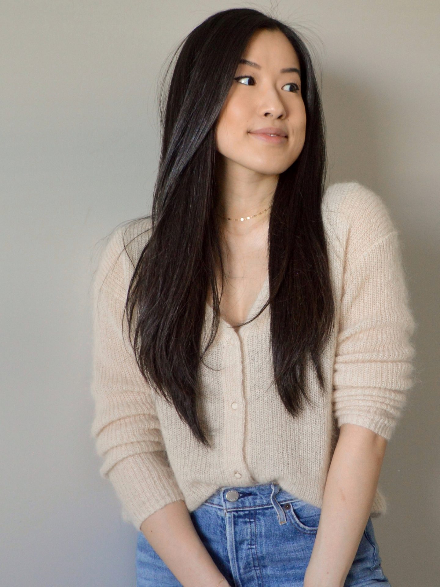 Outfit details: Knit sweater cardigan, blue straight jeans, dainty gold jewelry