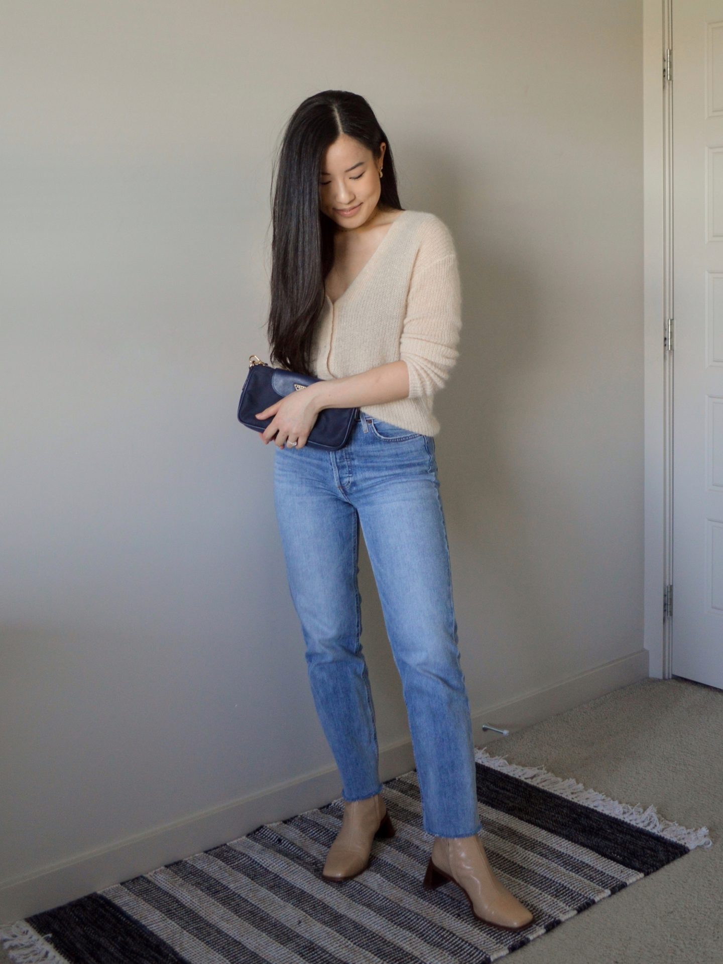 Parisian inspired outfit - knit sweater cardigan, blue straight jeans, nude ankle boots