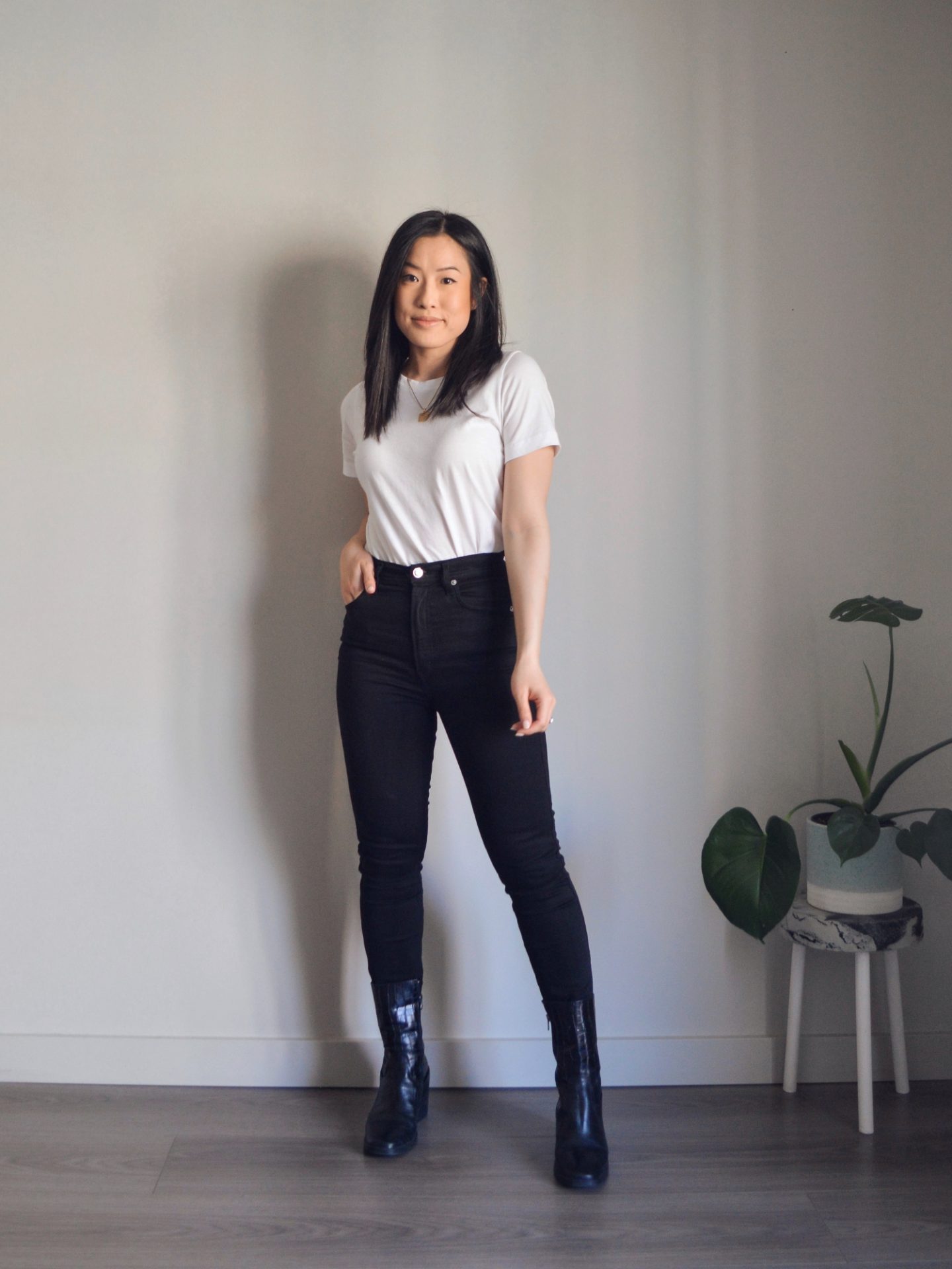 Outfit details: white t-shirt, black skinny jeans, black mid-calf boots