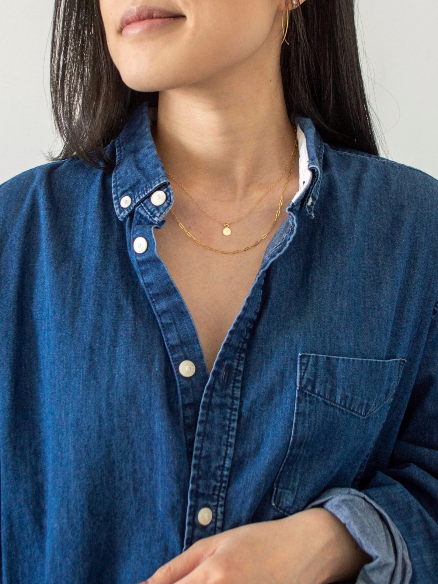 Her Simple Sole - wearing Sheena Marshall Jewelry. Delicate gold jewelry, Poppy Earrings, Carson Necklace, Nora Link Necklace, cotton denim button down shirt