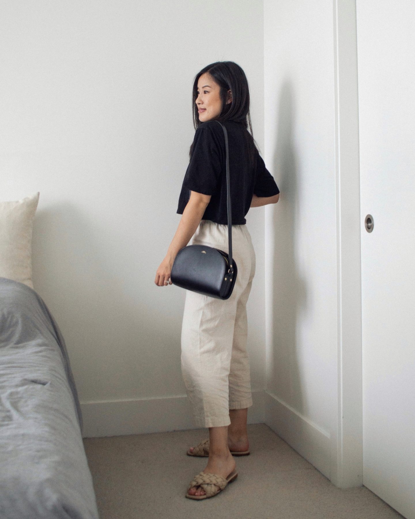 Summer Outfit Details: TNA Tour Cropped T-shirt, Harly Jae Aura Natural Linen Pant, L'intervalle Miriel braided criss-cross sandals, A.P.C. Black Demi-Lune Bag