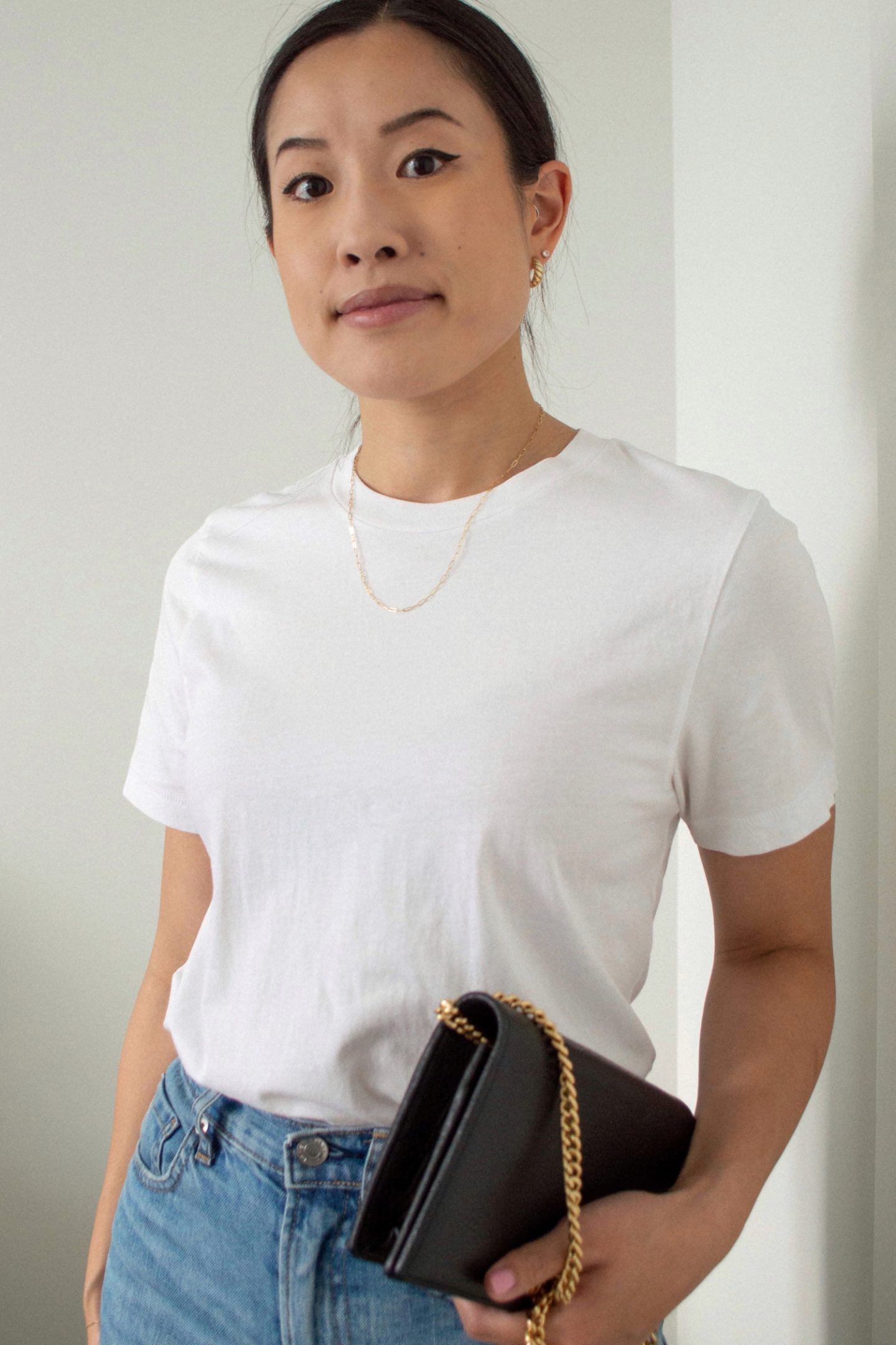 Outfit Details: Frank and Oak The Good Cotton Essential T-Shirt, Everlane Original Cheeky Jean, Gucci Marmont Leather Mini Chain Bag, Sheena Marshall Jewelry Nora Link Necklace, Mejuri Croissant Dome Hoops