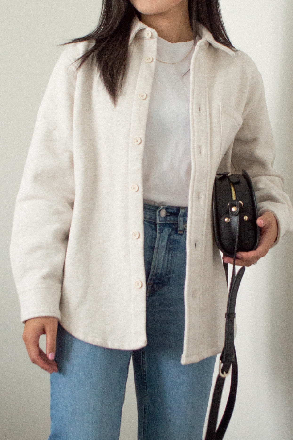 Outfit details: TNA Cozy Fleece Mega Shirt Jacket, Frank and Oak The Good Cotton Essential T-Shirt, Everlane The Original Cheeky Jean, A.P.C. Black Demi-Lune bag, Sheena Marshall Jewelry Nora Link Necklace