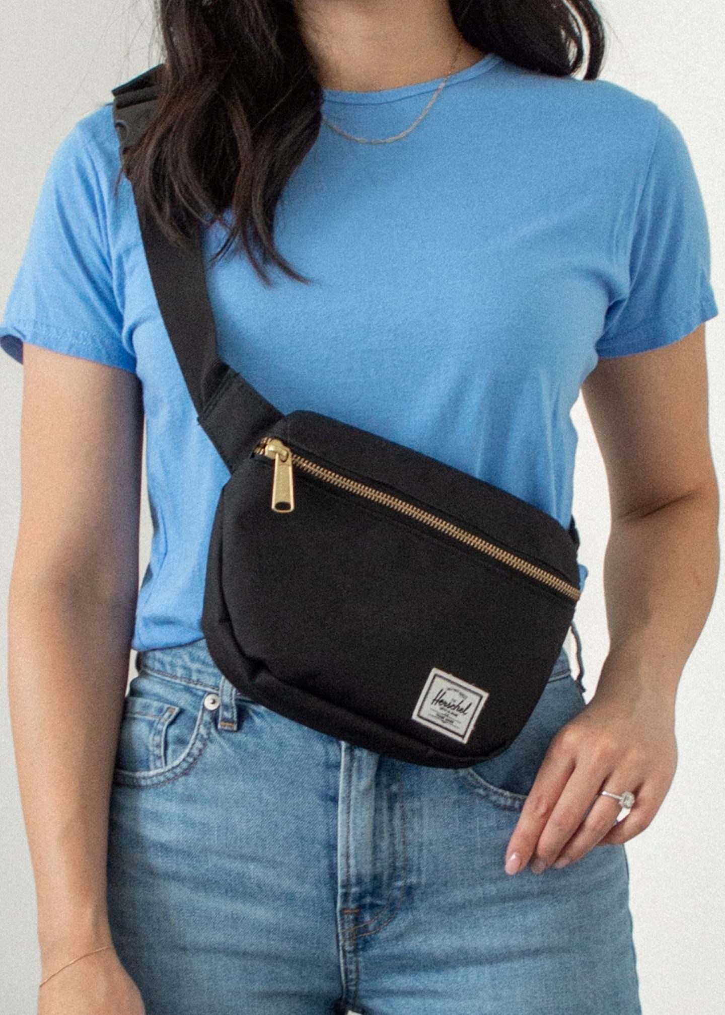 Her Simple Sole - Outfit details: Sheena Marshall Jewelry Nora Link Necklace, Encircled Fair Crew Neck in Ocean, Everlane The Original Cheeky Jeans in Sky Blue, Herschel Fifteen Hip Pack