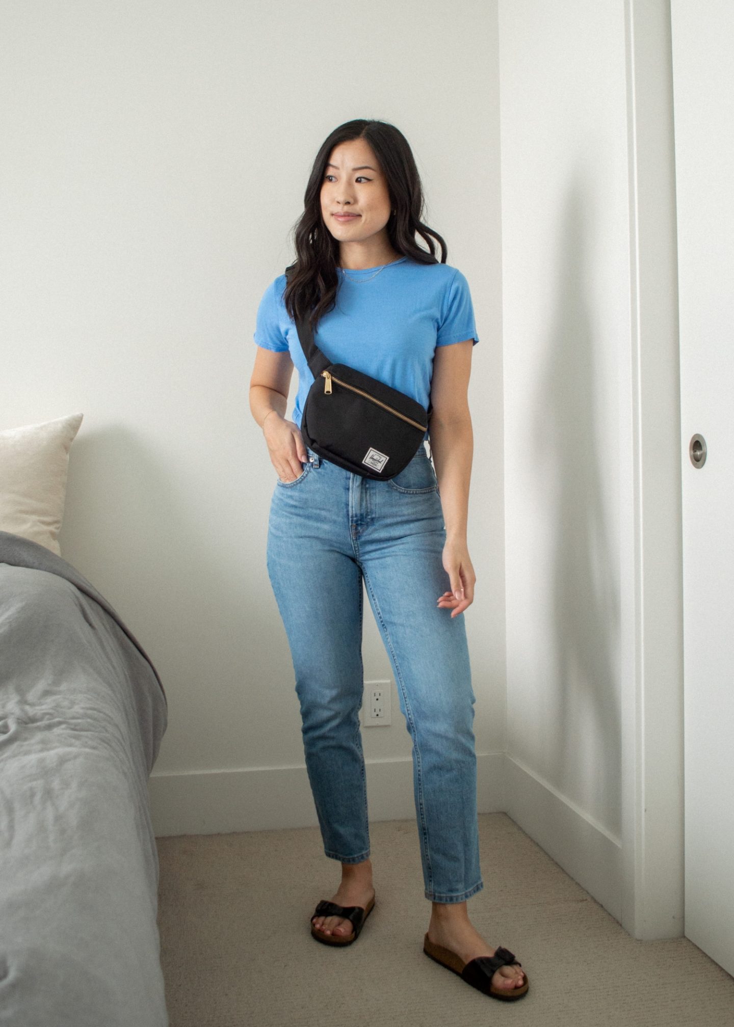 Her Simple Sole - Outfit details: Sheena Marshall Jewelry Nora Link Necklace, Encircled Fair Crew Neck in Ocean, Everlane The Original Cheeky Jeans in Sky Blue, Herschel Fifteen Hip Pack