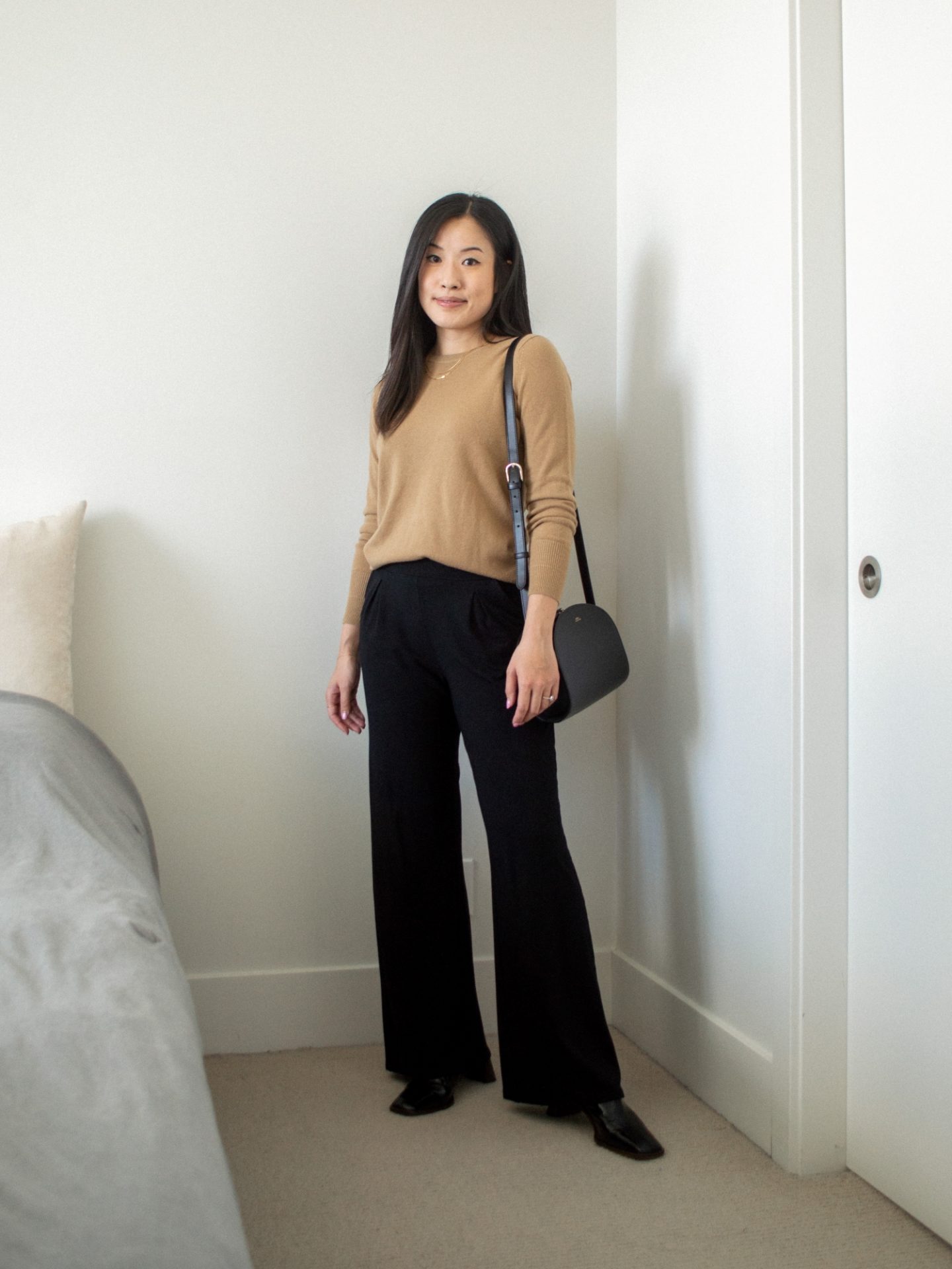 Outfit details: cashmere crewneck sweater, black wide leg pants, black crossbody bag, black mules, gold chain layered necklaces, outfit for fall, fall inspiration outfit