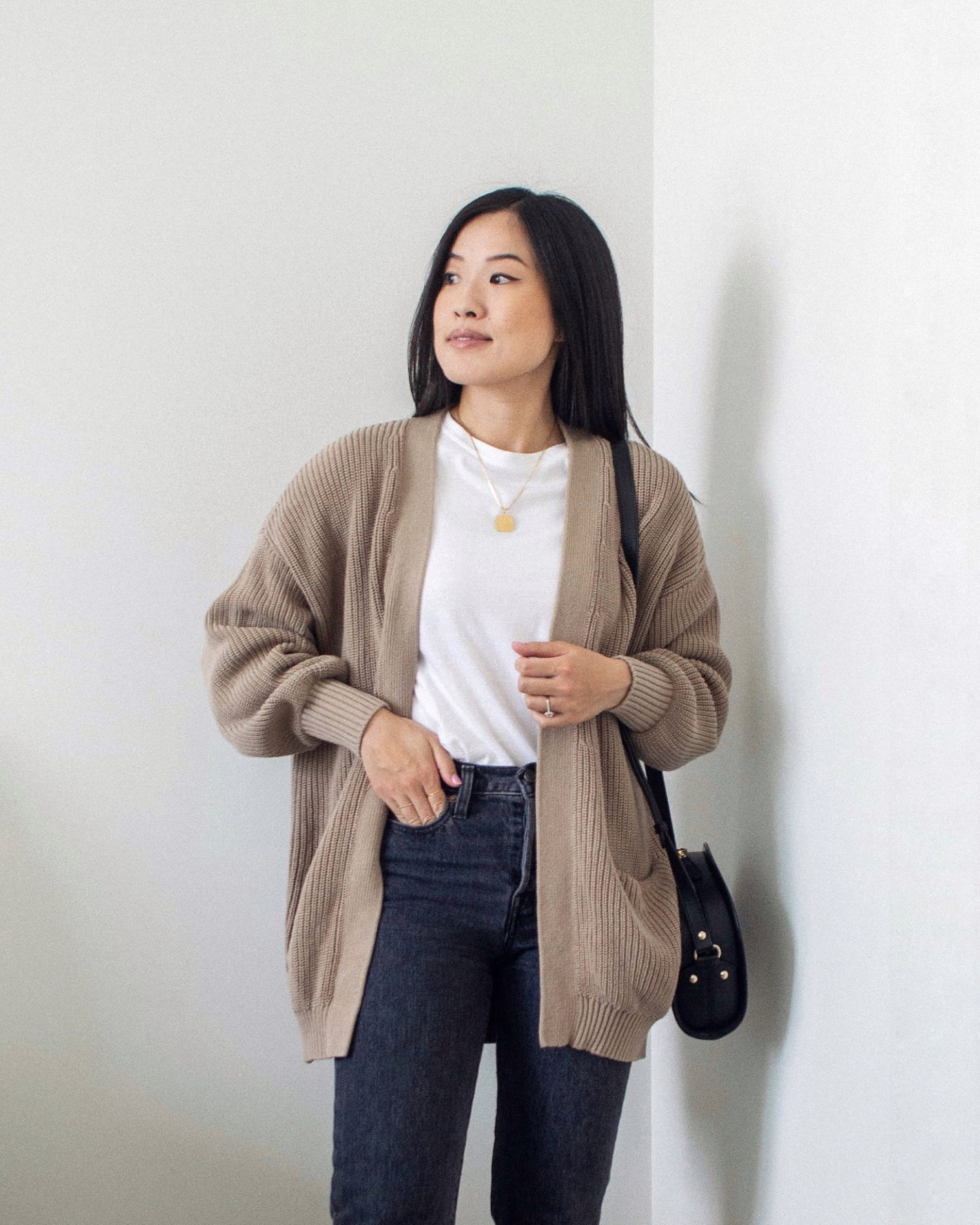 Outfit details - oversized cardigan, straight leg grey jeans, white t-shirt, black crossbody bag, layering style, cardigan style