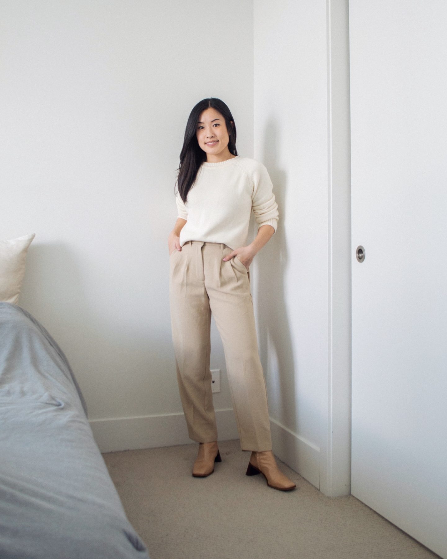 Outfit details - organic cotton sweater, beige trousers, nude ankle boots