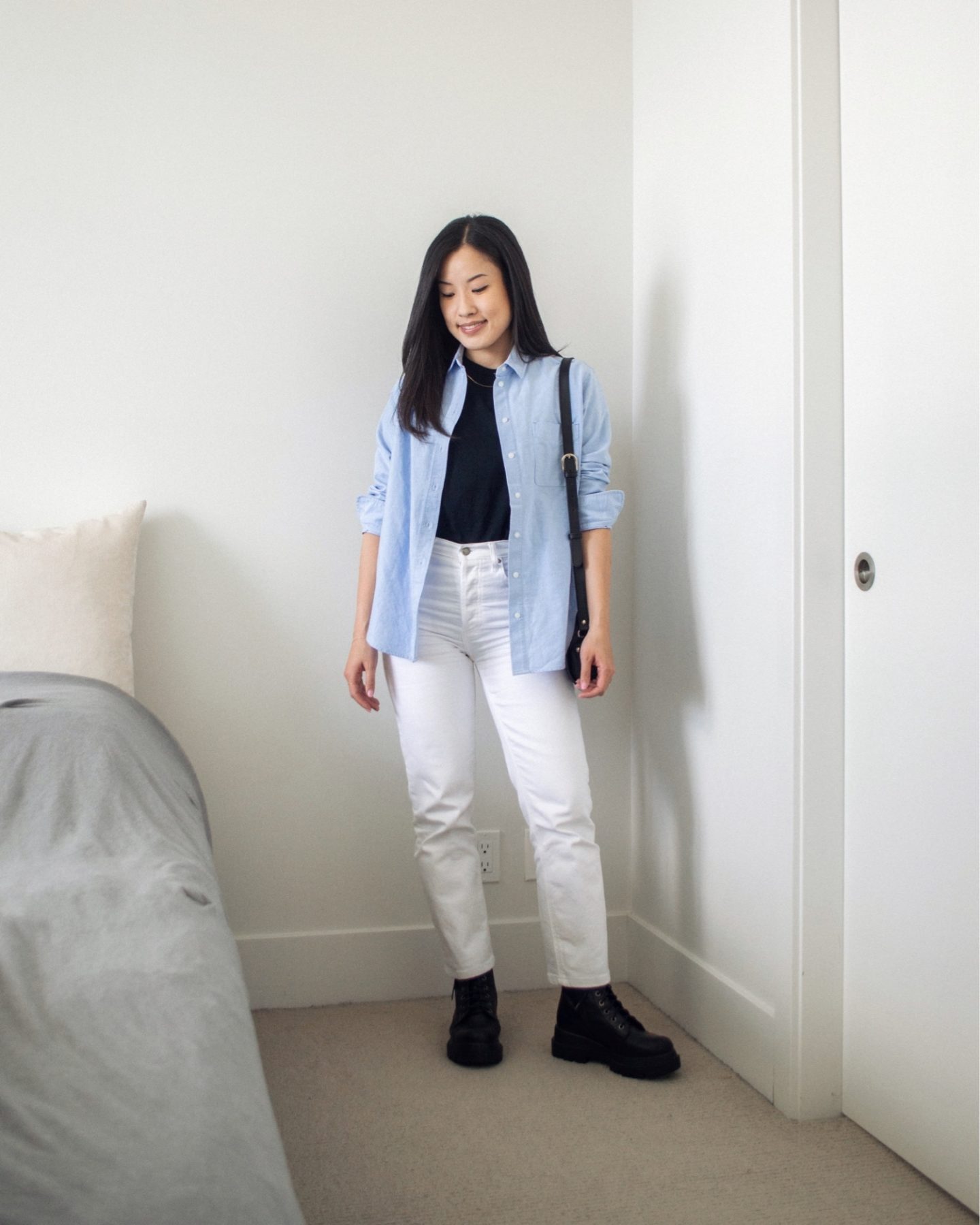 Outfit details - Everlane Relaxed Oxford Shirt, Frank and Oak The Essential Tee in Black, Denim Forum Arlo High Rise Jeans in White, L'intervalle Bolt Black Leather boots, A.P.C. Black Demi-Lune Bag