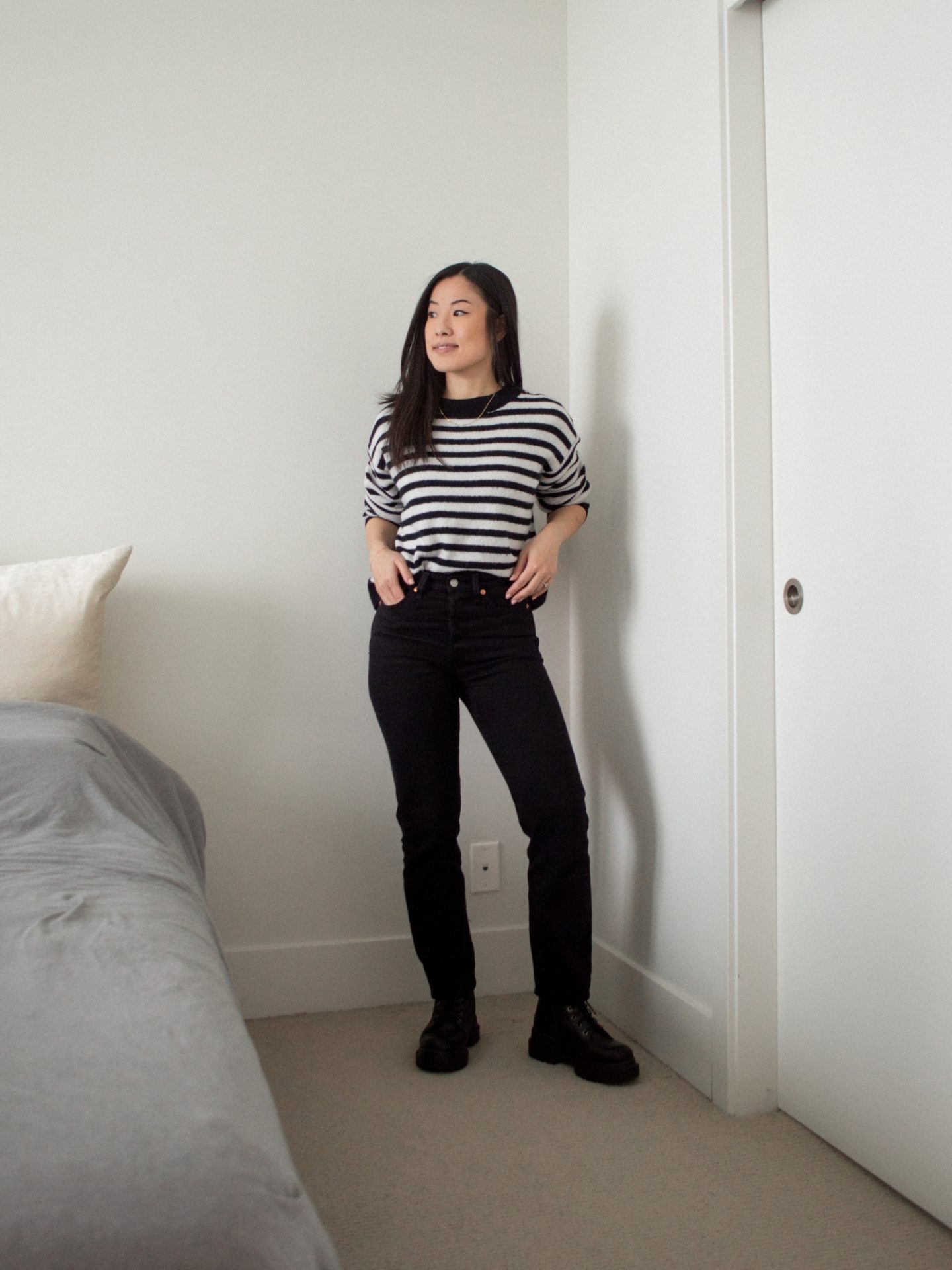 Outfit details: black and white striped sweater, black straight leg jeans, combat boots