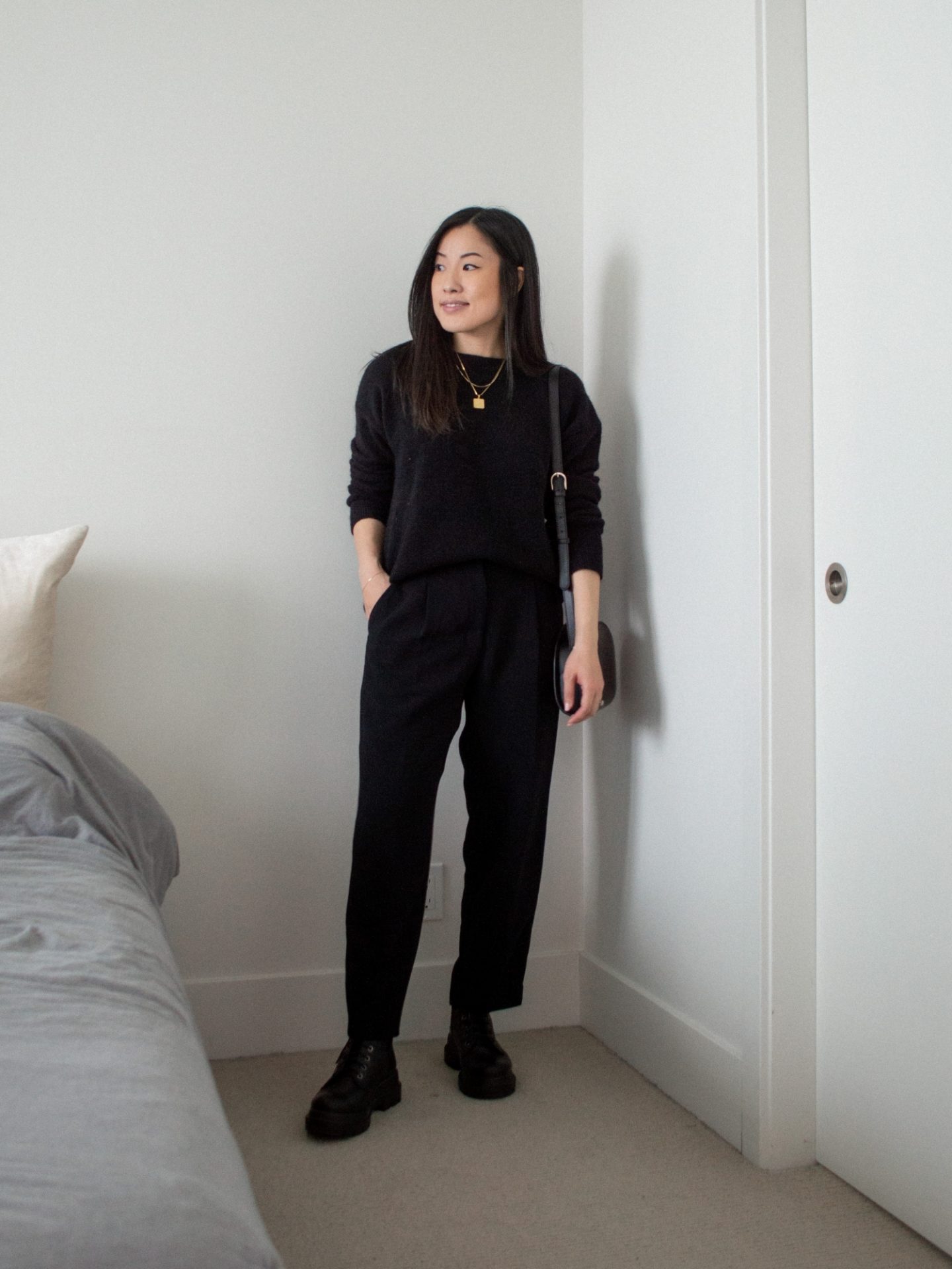 Outfit details - oversized black knit sweater, black trousers, combat boots, black bag, fall outfit, simple outfit idea for fall, black monochrome outfit