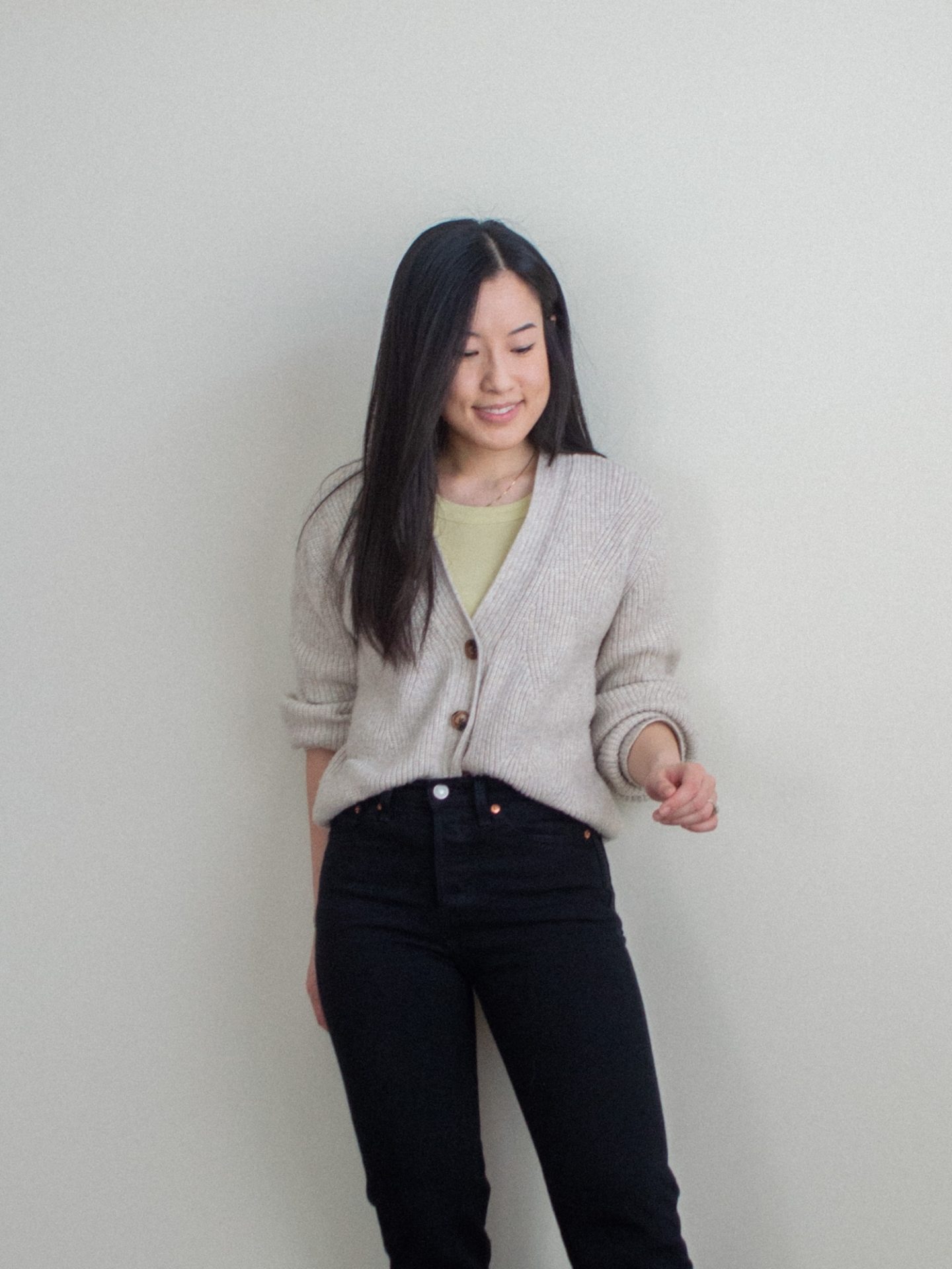 Outfit details: cozy textured v-neck cardigan, basic yellow tank top, black straight leg jeans. Her Simple Sole blog, casual outfit with a pop of color, minimalist outfit with black jeans