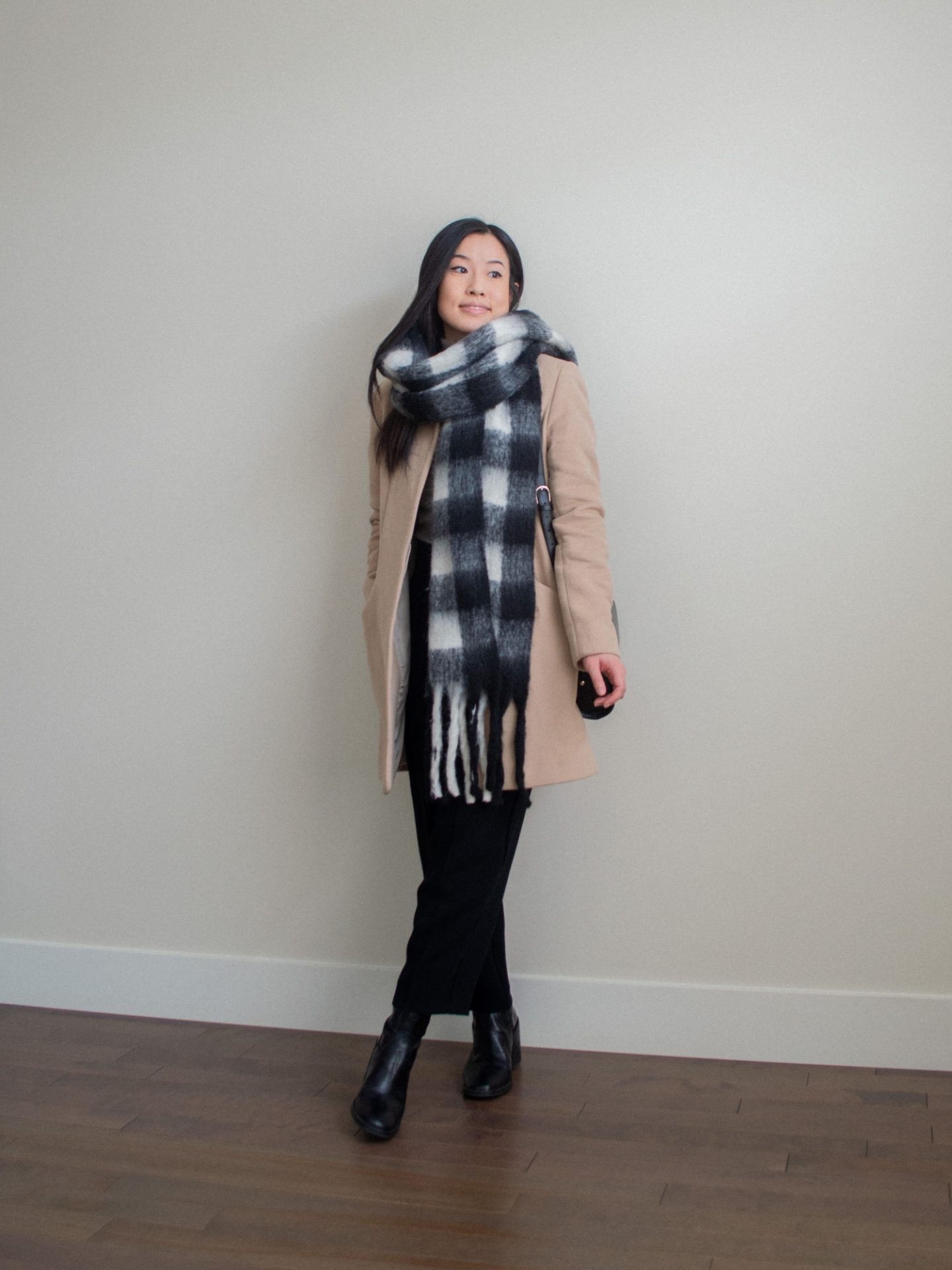 Outfit details: oversized checkered scarf, camel cocoon coat, black trousers, black mid-calf boots, black half moon bag. Her Simple Sole blog, casual winter outfit idea