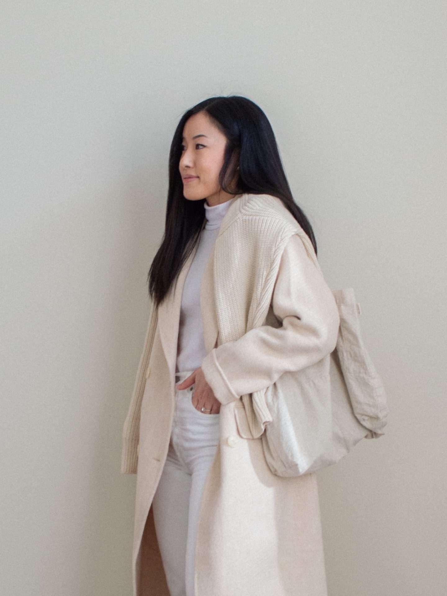 Outfit details: white turtleneck top, white straight leg jeans, cream wool coat, cream knitted cotton cardigan, linen tote bag. Her Simple Sole blog, white monochrome outfit, light colored winter outfit