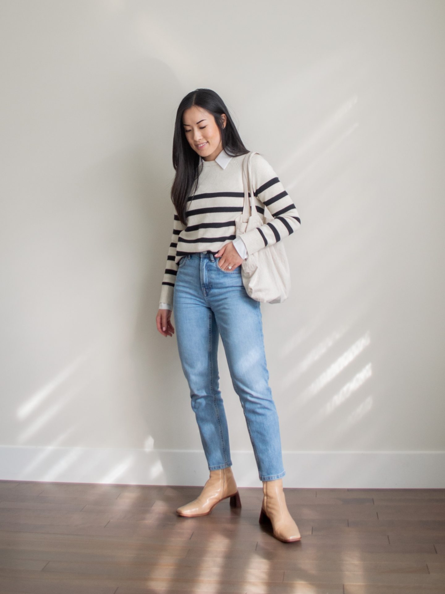 Outfit details - striped cotton and wool blend sweater, blue original cheeky jean, beige ankle boots, classic fall outfit, fall layering outfit, quality wardrobe essentials