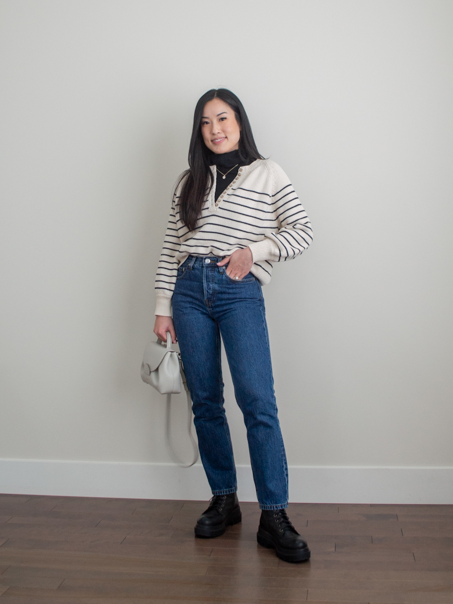 Her Simple Sole outfit photo featuring a stripe cotton sweater, black turtleneck top, dark wash straight leg jeans, black chunky combat boots, off-white crossbody bag