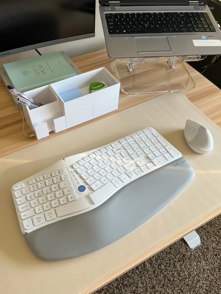 Ergonomic and organized desk set up featuring the Logitech Lift Vertical Ergonomic Mouse and Bostitch Konnect Desk Organizer and Charging Station