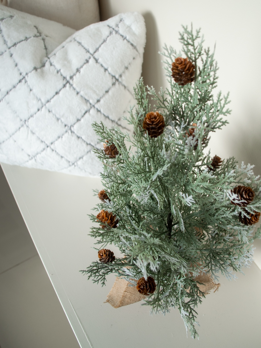 Her Simple Sole intentional home ideas featuring mini Christmas tree wrapped in burlap, faux fur pillow