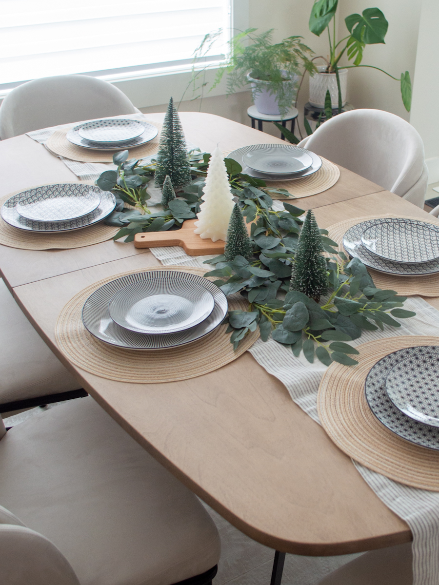 Her Simple Sole shot of dining room setup with Angelo Dining Chairs from Rove Concepts, Boomerang Dining Table from Revolve Furnishings, Sola Rug from Rove Concepts, modern minimal dining room setup