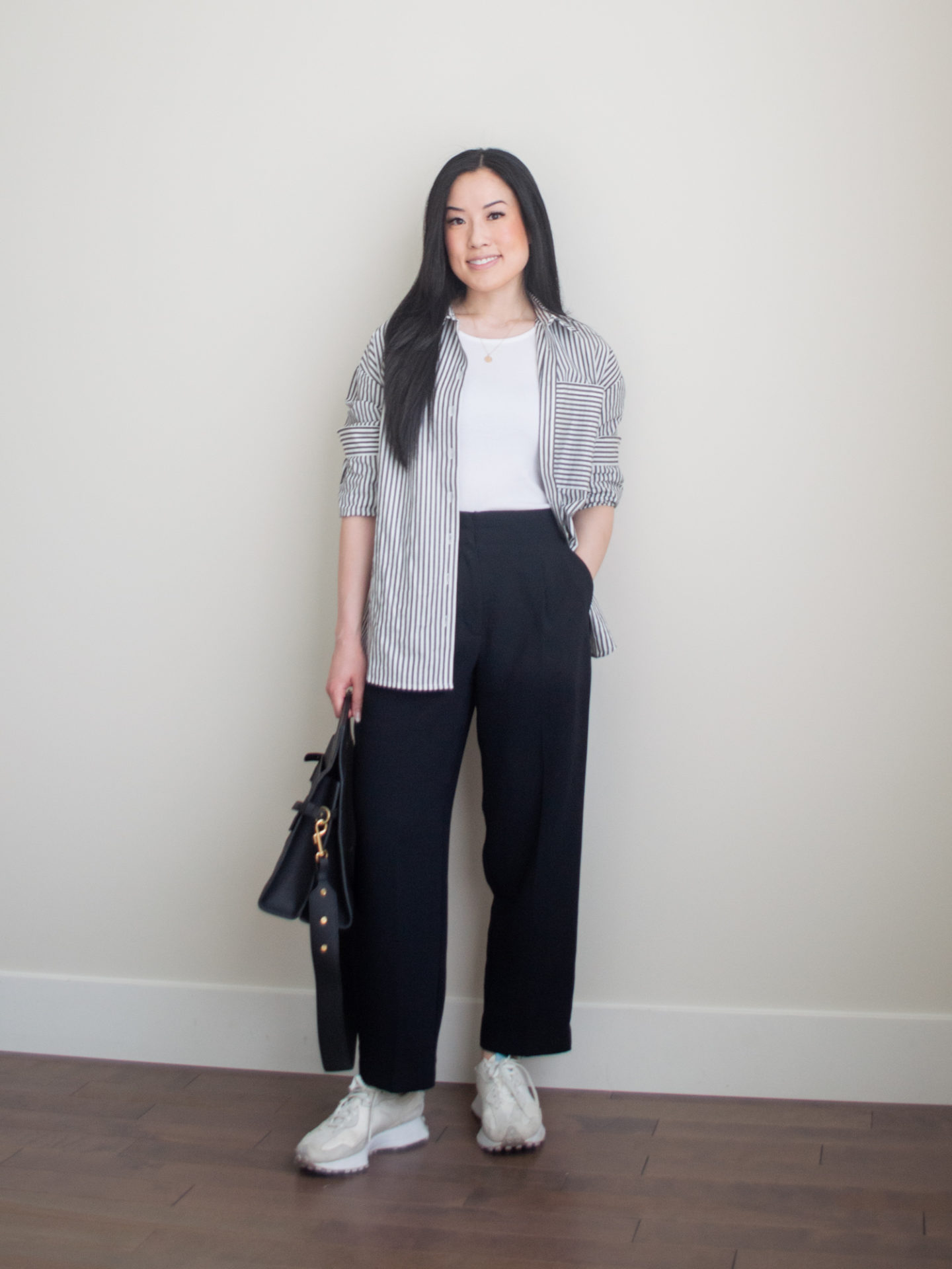 Sharon of Her Simple Sole showcases some of her favourite easy spring outfits that anyone can recreate using minimal, comfortable, and functional items from her intentional wardrobe | spring outfit ideas | minimalist outfit ideas | smart casual outfit | stripe button up shirt outfit | pants and sneakers outfit