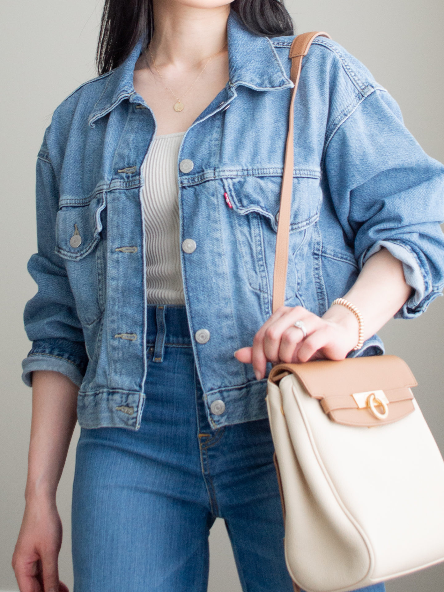 Close-up detailed outfit shot of Sharon of Her Simple Sole wearing minimal, comfortable, and functional items from her intentional wardrobe | minimalist outfit ideas | double denim outfit | denim on denim outfit | wide leg jeans outfit