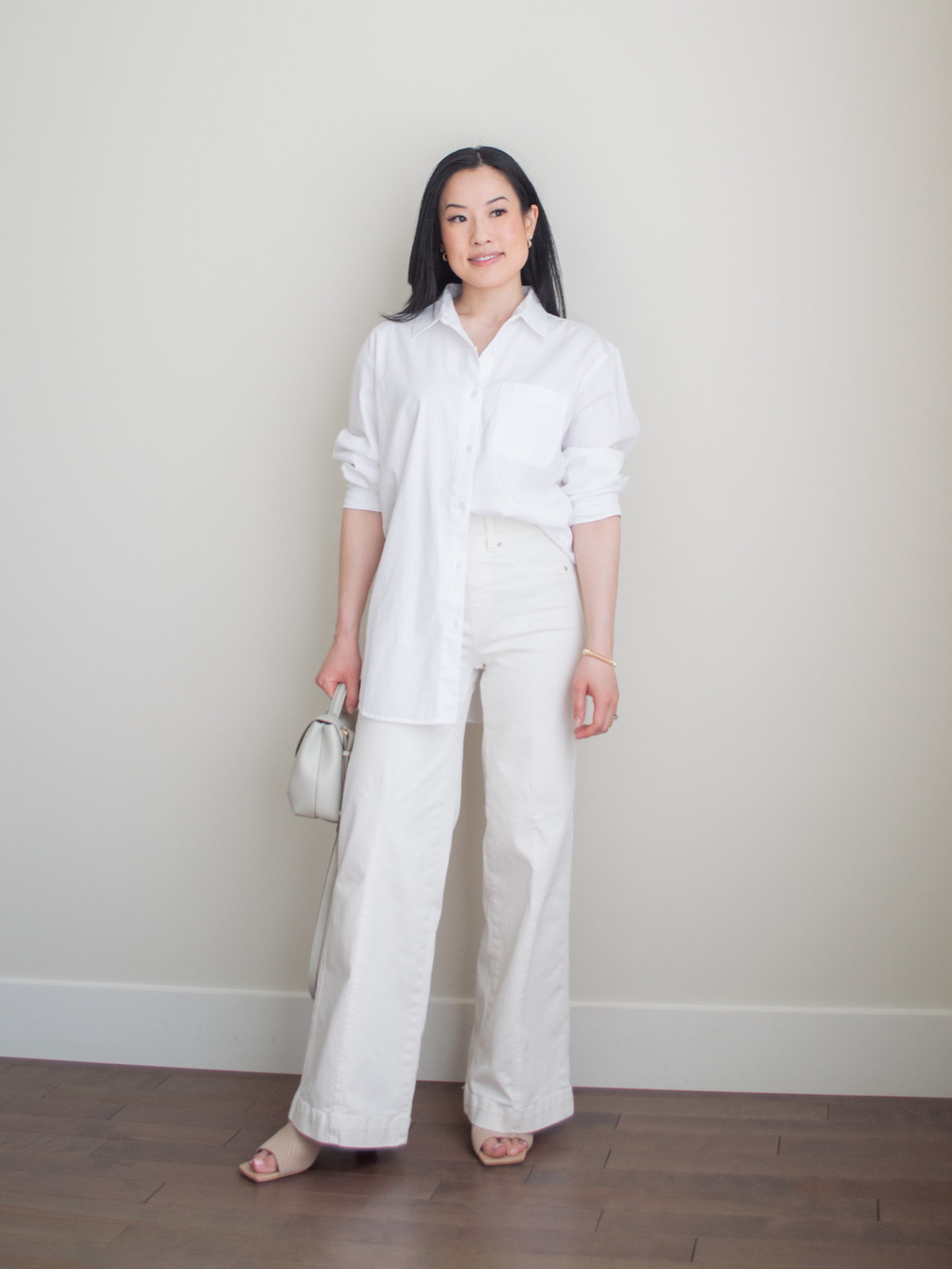 Sharon of Her Simple Sole showcases some of her favourite easy spring outfits that anyone can recreate using minimal, comfortable, and functional items from her intentional wardrobe | spring outfit ideas | minimalist outfit ideas | white monochrome outfit | cream wide leg jeans outfit | smart casual outfit | white oversized button up shirt outfit