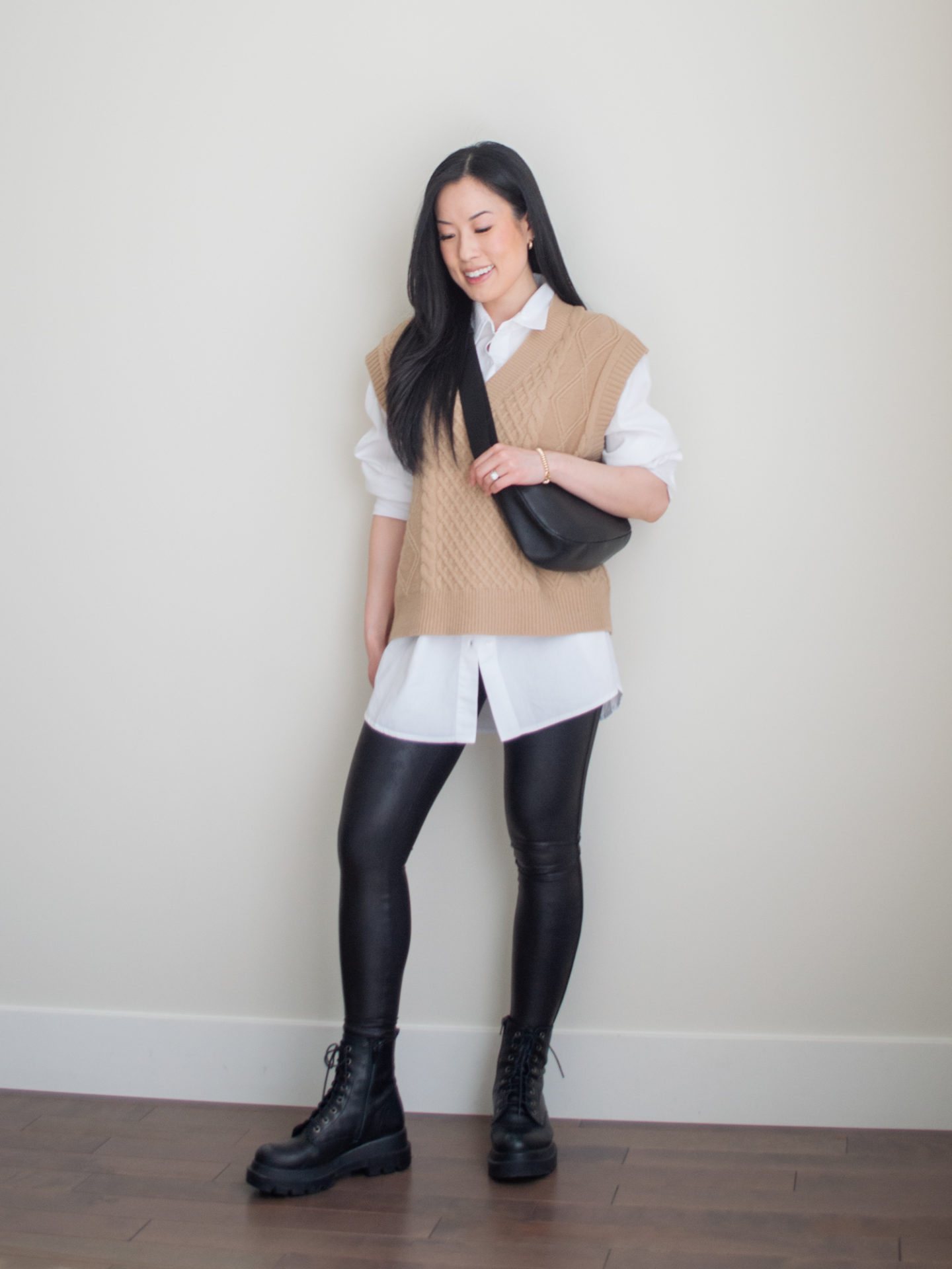 Sharon of Her Simple Sole showcases some of her favourite easy spring outfits that anyone can recreate using minimal, comfortable, and functional items from her intentional wardrobe | spring outfit ideas | minimalist outfit ideas | button up shirt and sweater vest outfit | casual chic outfit | faux leather leggings outfit | combat boots edgy and preppy outfit