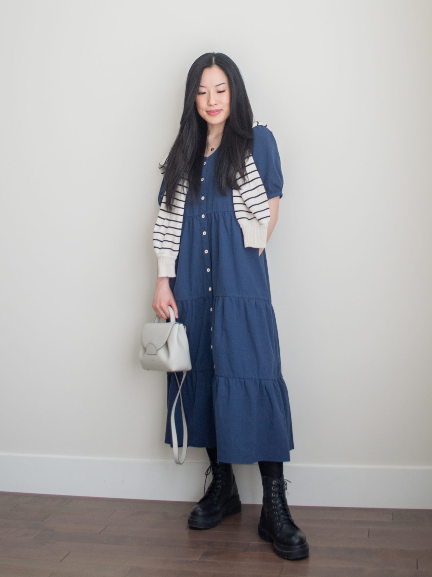 Sharon of Her Simple Sole showcases some of her favourite easy spring outfits that anyone can recreate using minimal, comfortable, and functional items from her intentional wardrobe | spring outfit ideas | minimalist outfit ideas | blue tiered midi dress outfit | sweater over the shoulders outfit