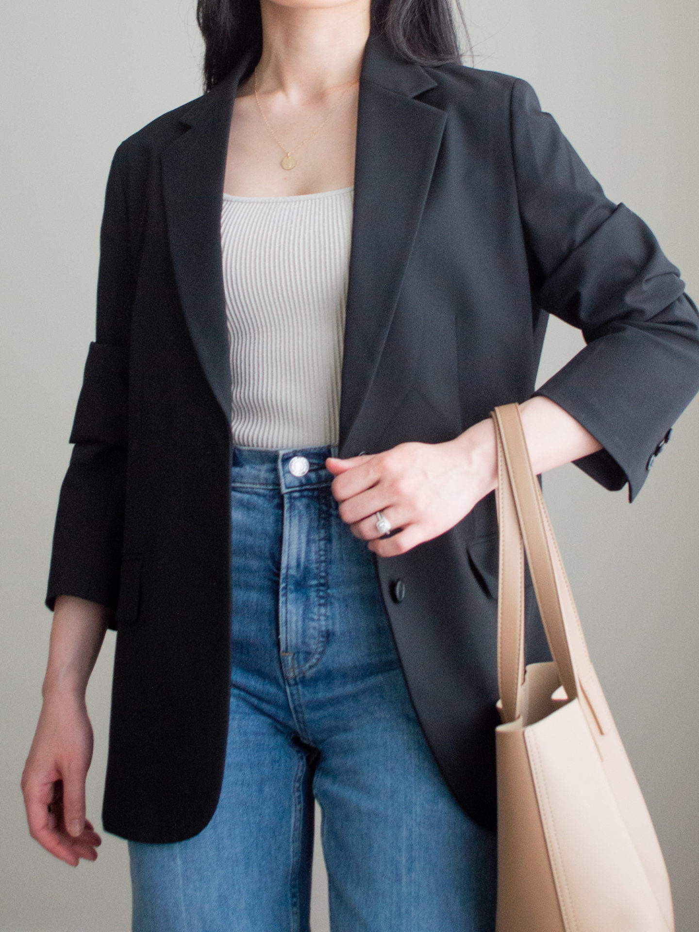 Close-up detailed outfit shot of Sharon of Her Simple Sole wearing minimal, comfortable, and functional items from her intentional wardrobe | minimalist outfit ideas | smart casual outfit | blazer and jeans outfit