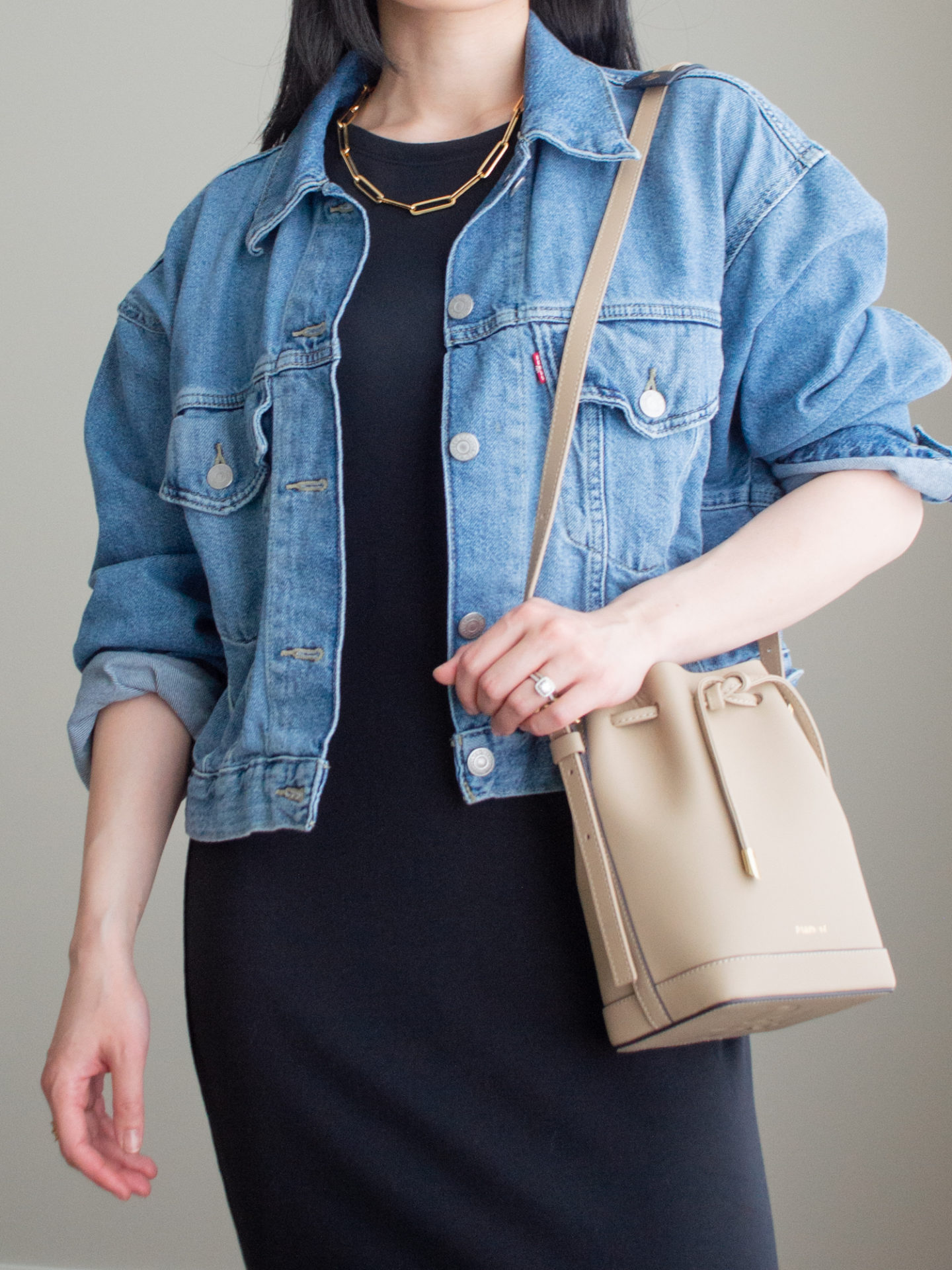 Close-up detailed outfit shot of Sharon of Her Simple Sole wearing minimal, comfortable, and functional items from her intentional wardrobe | minimalist outfit ideas | maxi t-shirt dress outfit | cropped denim jacket outfit | dress and denim jacket outfit