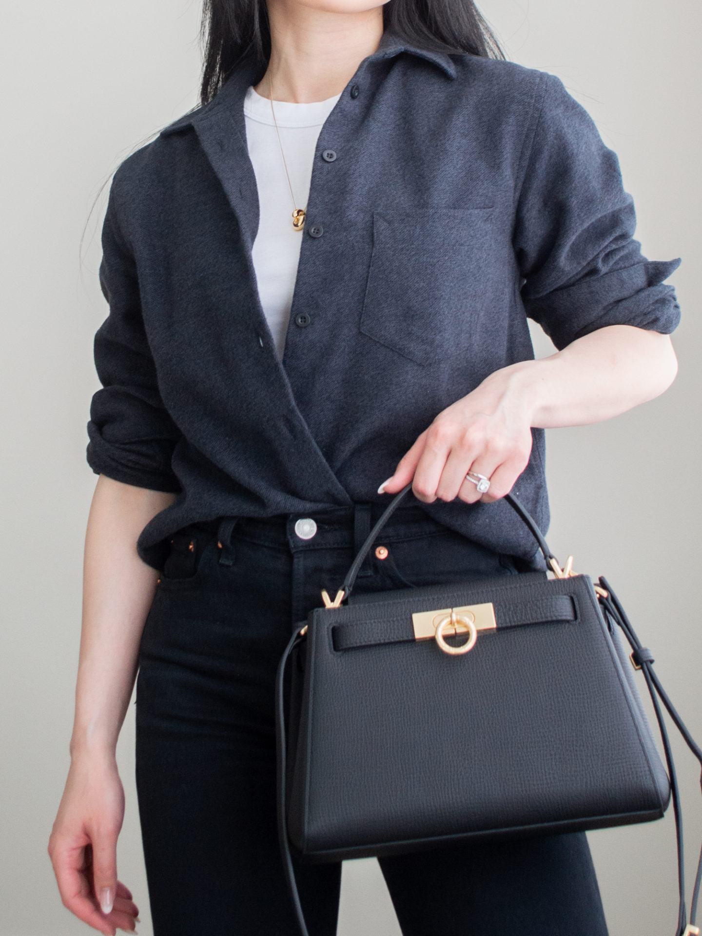 Close-up detailed outfit shot of Sharon of Her Simple Sole wearing minimal, comfortable, and functional items from her intentional wardrobe | minimalist outfit ideas | monochrome black and white outfit | casual button-up shirt outfit