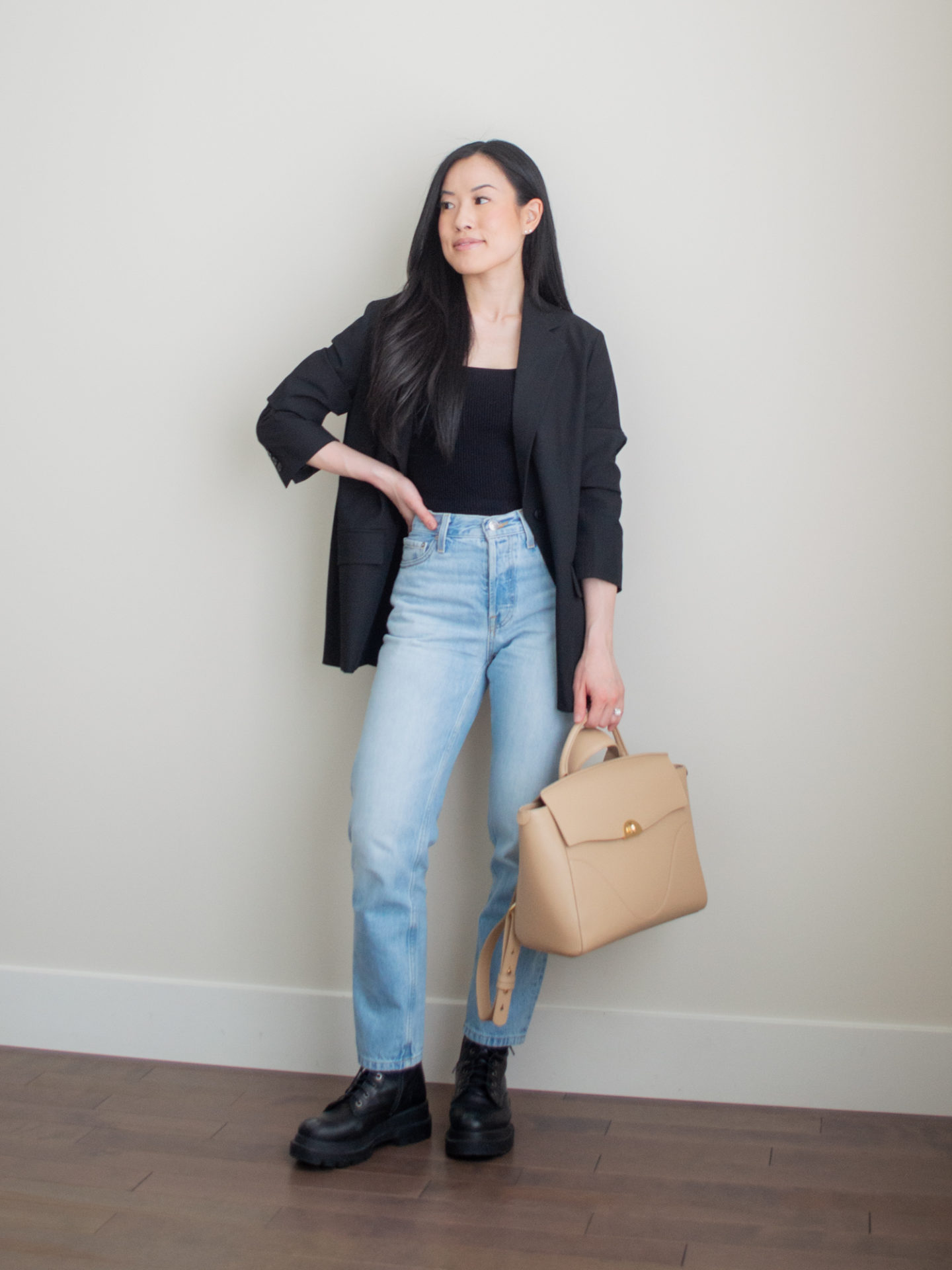 Sharon of Her Simple Sole showcases what to pack for vacation, including minimal and functional outfit ideas | blazer and jeans outfit | dinner date outfit | smart casual outfit | vacation packing list 